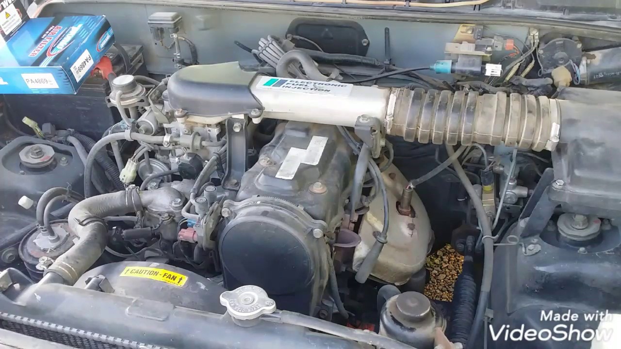 My 1993 Geo Tracker needs a tune up, I think... Let's take care of that! Cap, Rotor, & Sparkplugs