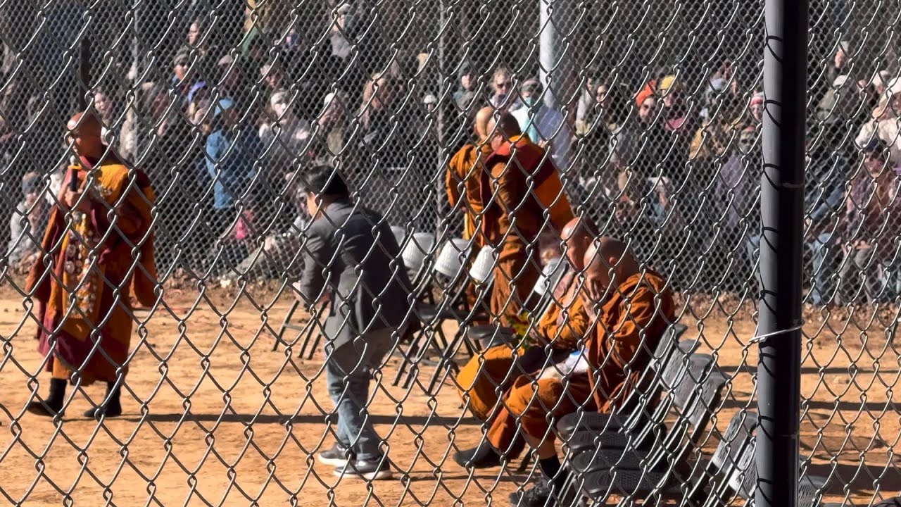 He bowed his head and begged the monk and the group of travelers to distribute food to everyone.