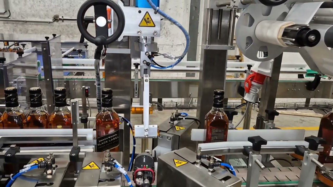 Tamper Evident Complete Labeling machine for whisky bottles including vision orientation