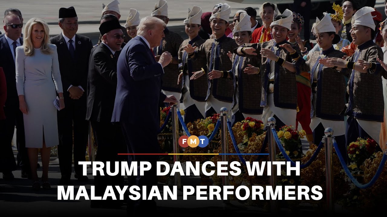 Trump dances with Malaysian performers