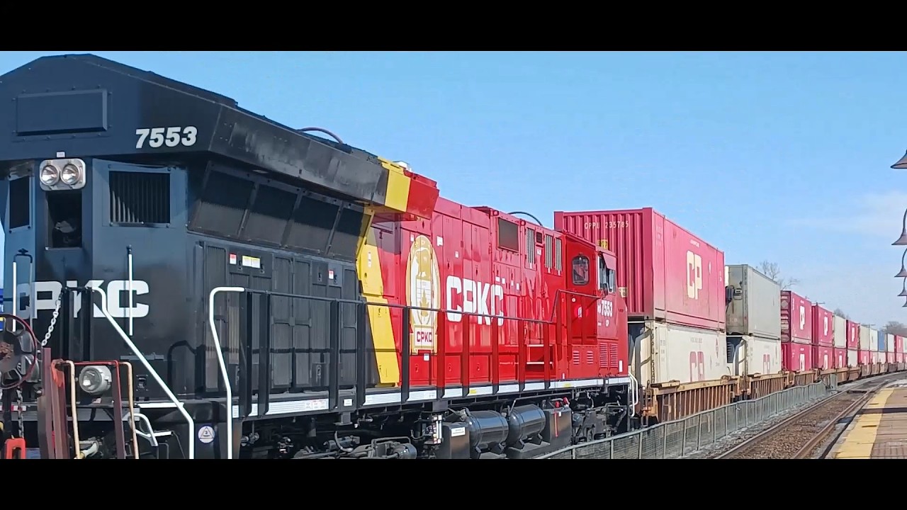 3 4 26 ДЛИННЫЙ ПОЕЗД CPKC % КОРОТКИЙ CN НА СТАНЦИИ ПУЭНТ-КЛЕР, МОНТРЕАЛЬ