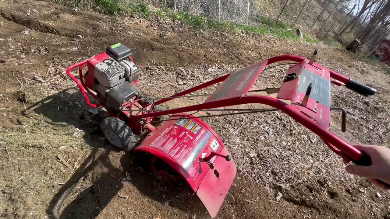 Troy-Bilt Pony Tiller Working the Dirt in the Garden... Birda the Dog Is Helping too.
