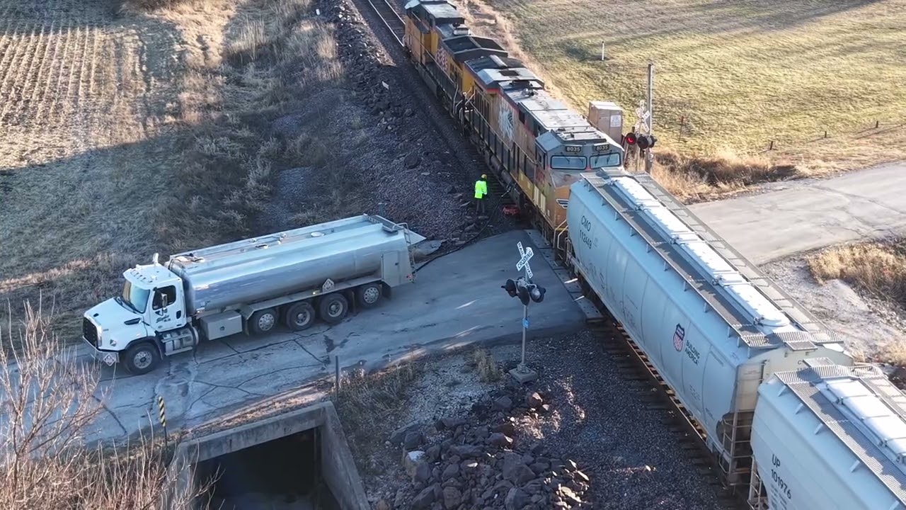 Drone video of southbound Union Pacific grain train refueling in Cambridge, Iowa on the Spine Line