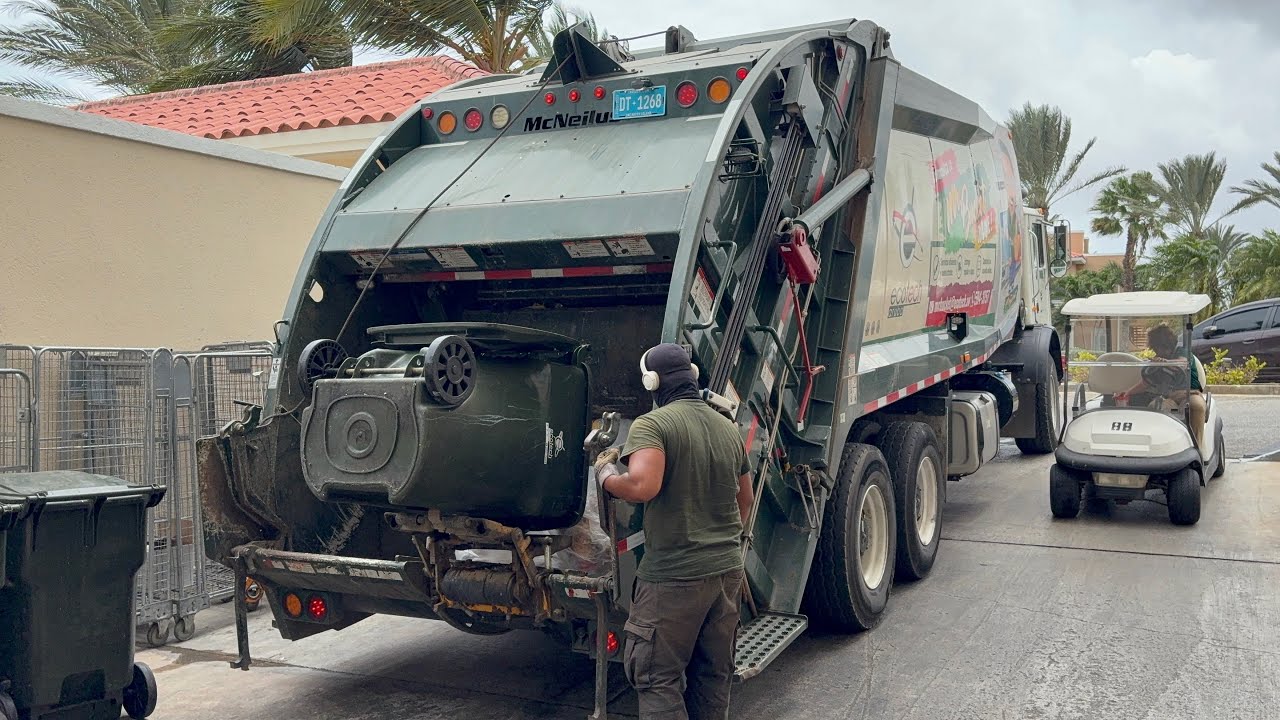 EcoTech Disposal Mack MRU McNeilus Rear Loader Garbage Truck Packing Heavy Garbage