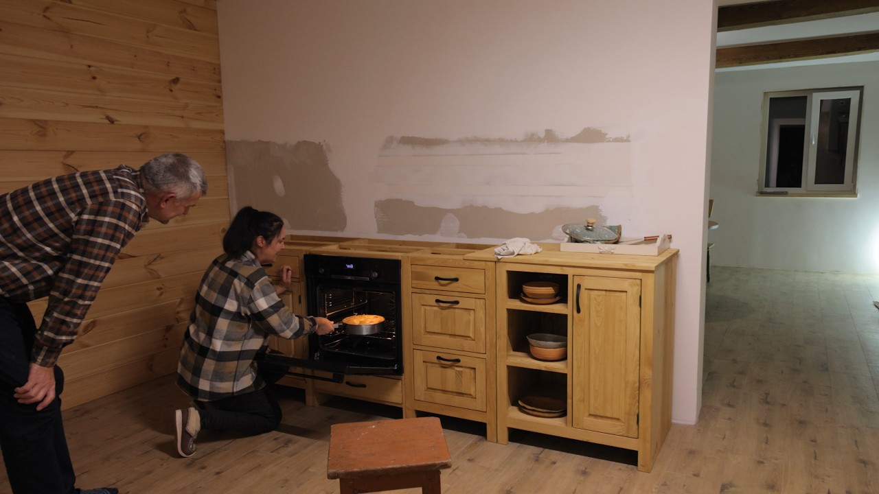 Country life in a remote village. Unpacking furniture. Apple pie by the fireplace
