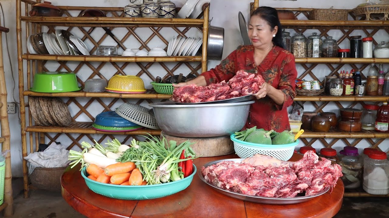 Sweet grandma cook cow bone soup for family | Noodle cow soup cooking