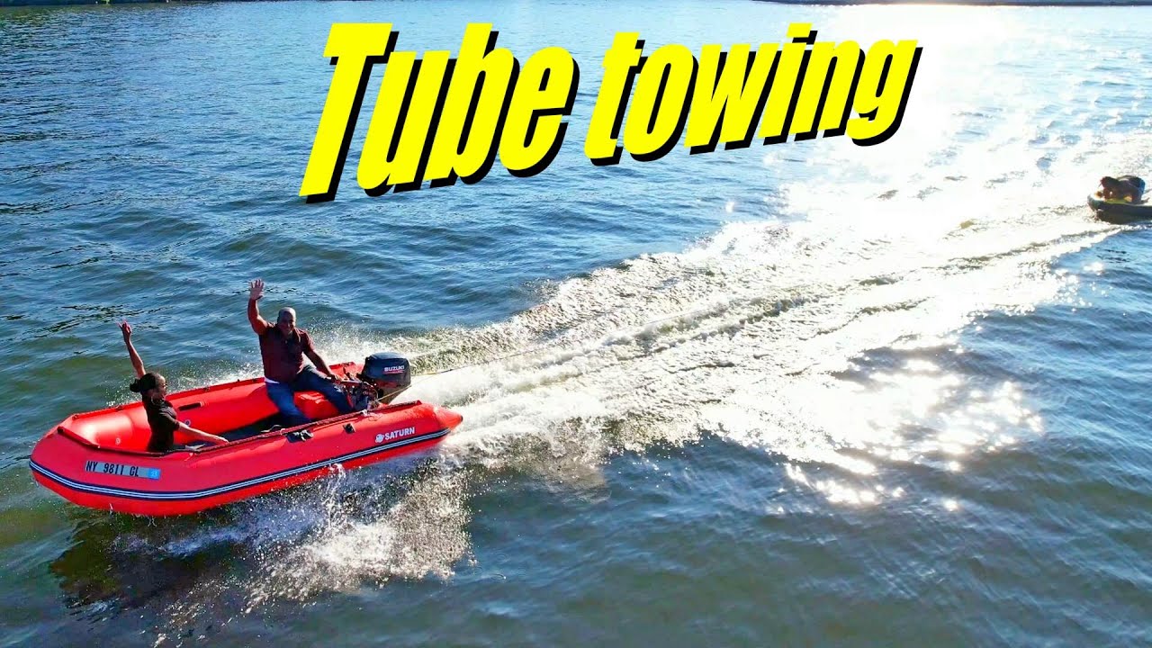 Inflatable Boat Saturn SD385 towing the tube. Saturn offers best quality and most affordable boats.