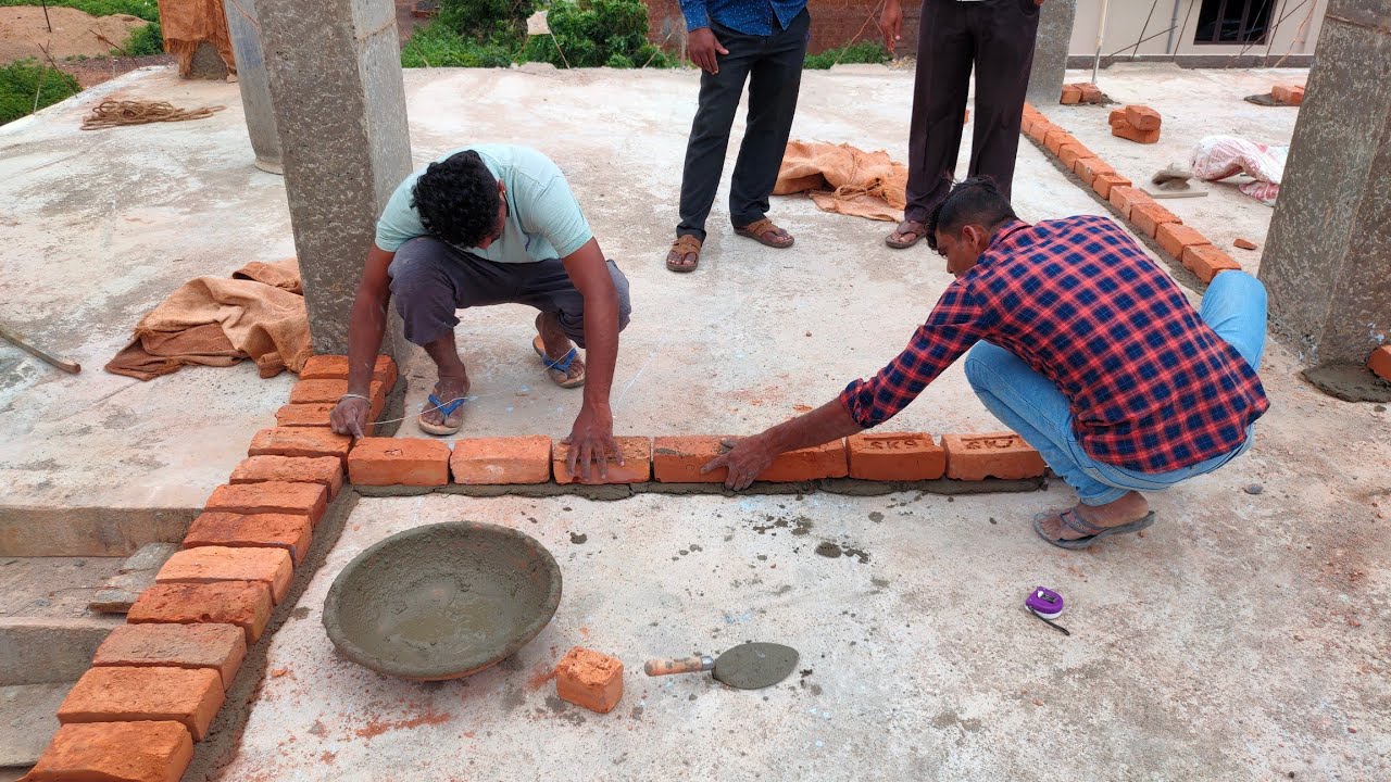 Brick work starting on slab first floor construction