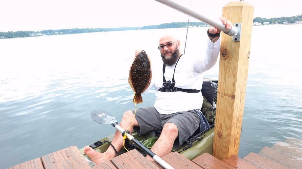 Kayak fishing for fluke on shark river inlet