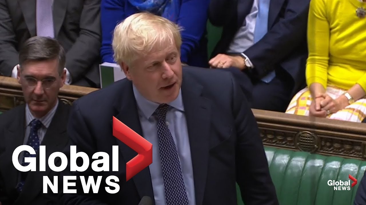 Boris Johnson reacts after U.K. Parliament votes to delay Brexit deal approval
