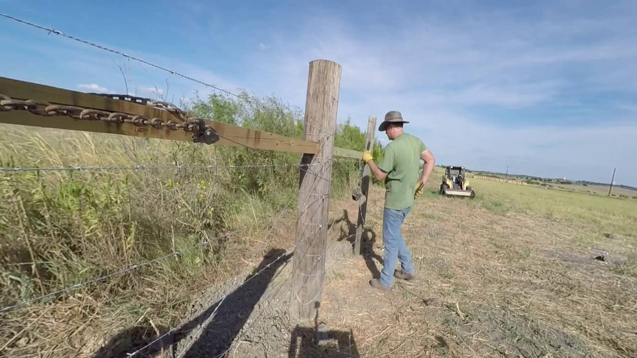 Running & stretching barbed wire fence