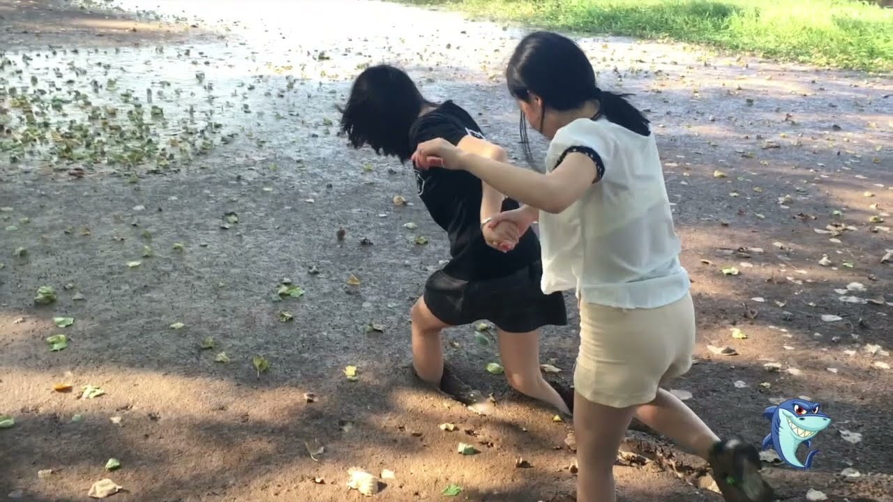Two girl run in mud with dress