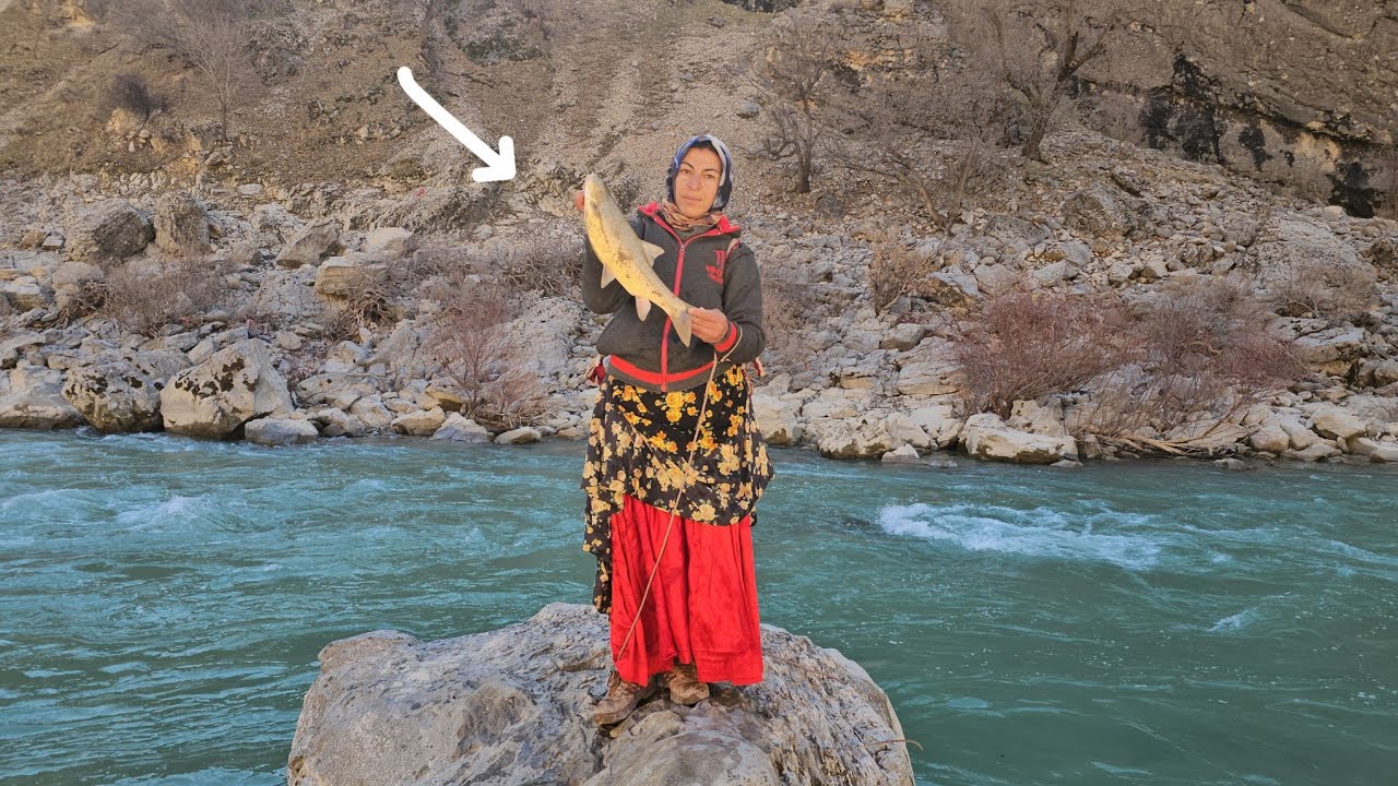 Khadija caught a big fish in the middle of the sea. Scenic and green places.