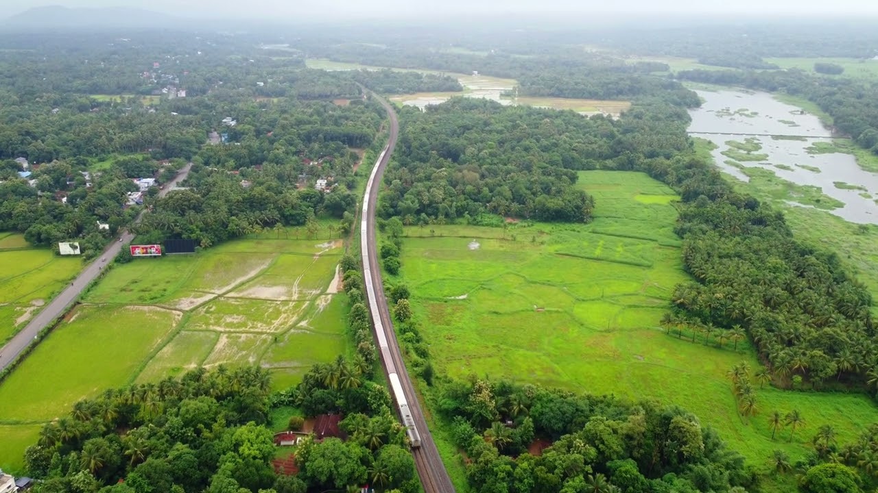 Ottappalam, Kerala Drone Footage: Serene Paddy Fields, Lush Greenery, and a Passing Train!