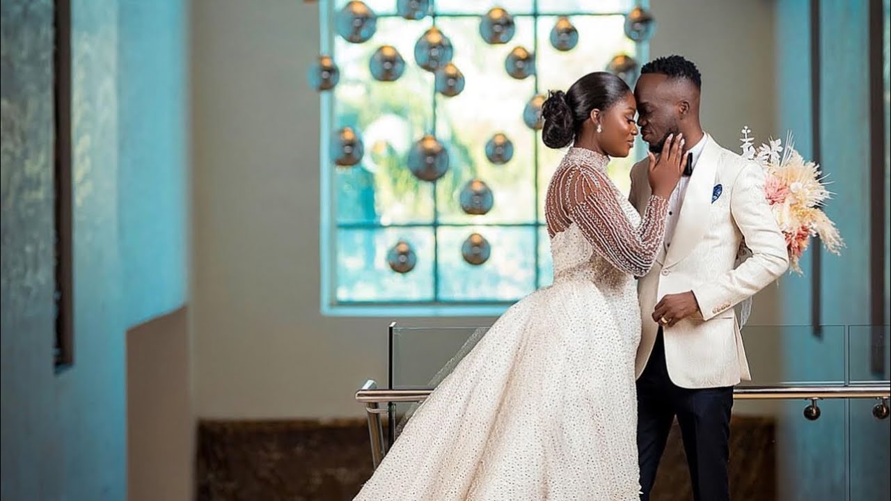 Akwaboah Passionately kisses wife and performs love songs for her at wedding