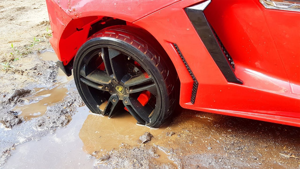 Red power wheels Lambo stuck in the mud