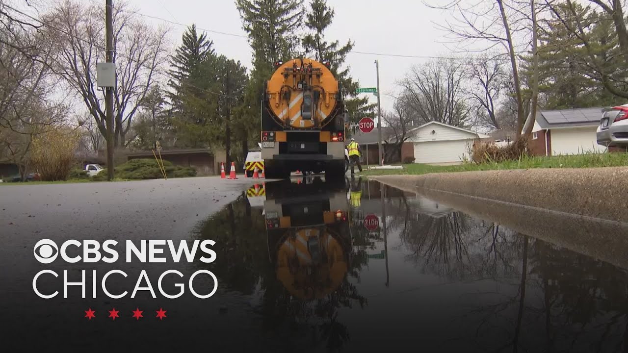 Aurora city workers try to cut flooding off at the pass before severe storms