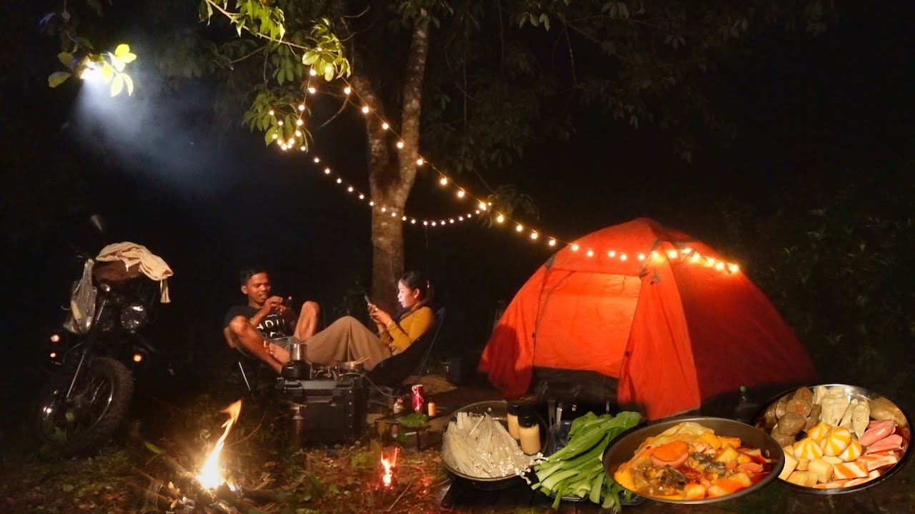Camping and cooking, set up camp by a beautiful natural lake.Cooking dinner 