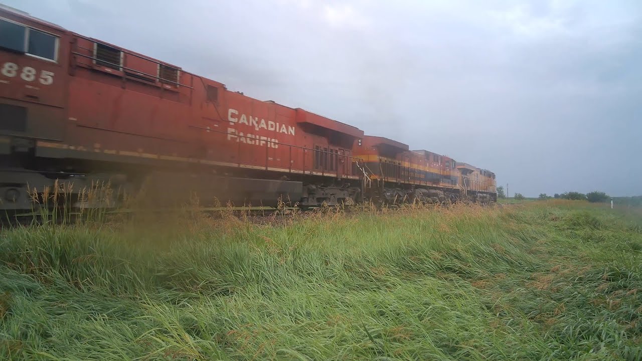 UP KCS & CP Locomotives in the rain on the Spine Line