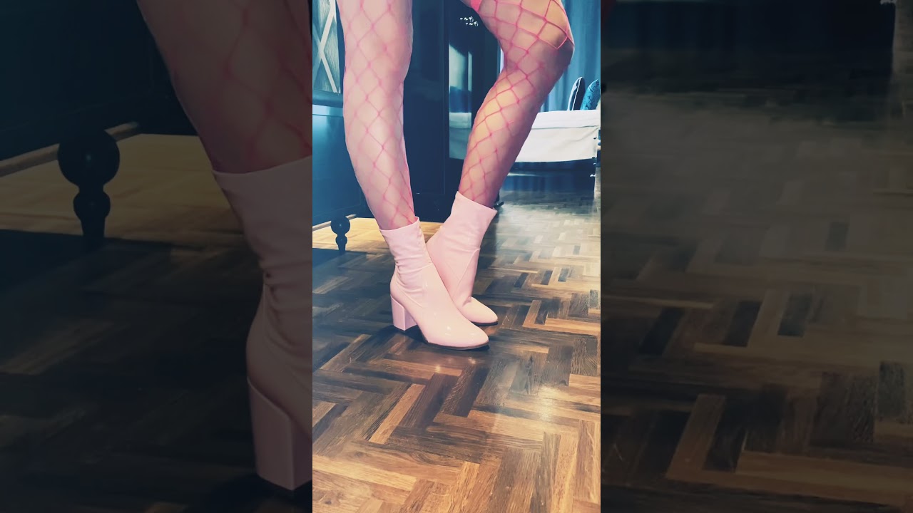 Pink ankle boots and pink fishnets