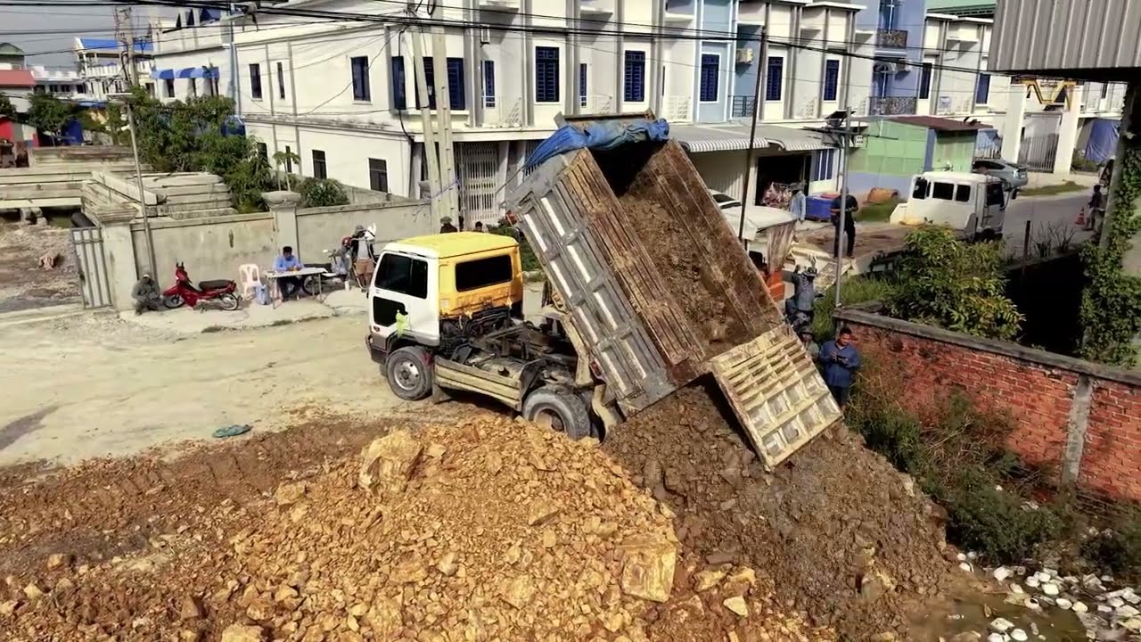 Awesome Start! Komatsu D31P Dozer & 5 Ton Dump Truck Begin New Landfill Project.