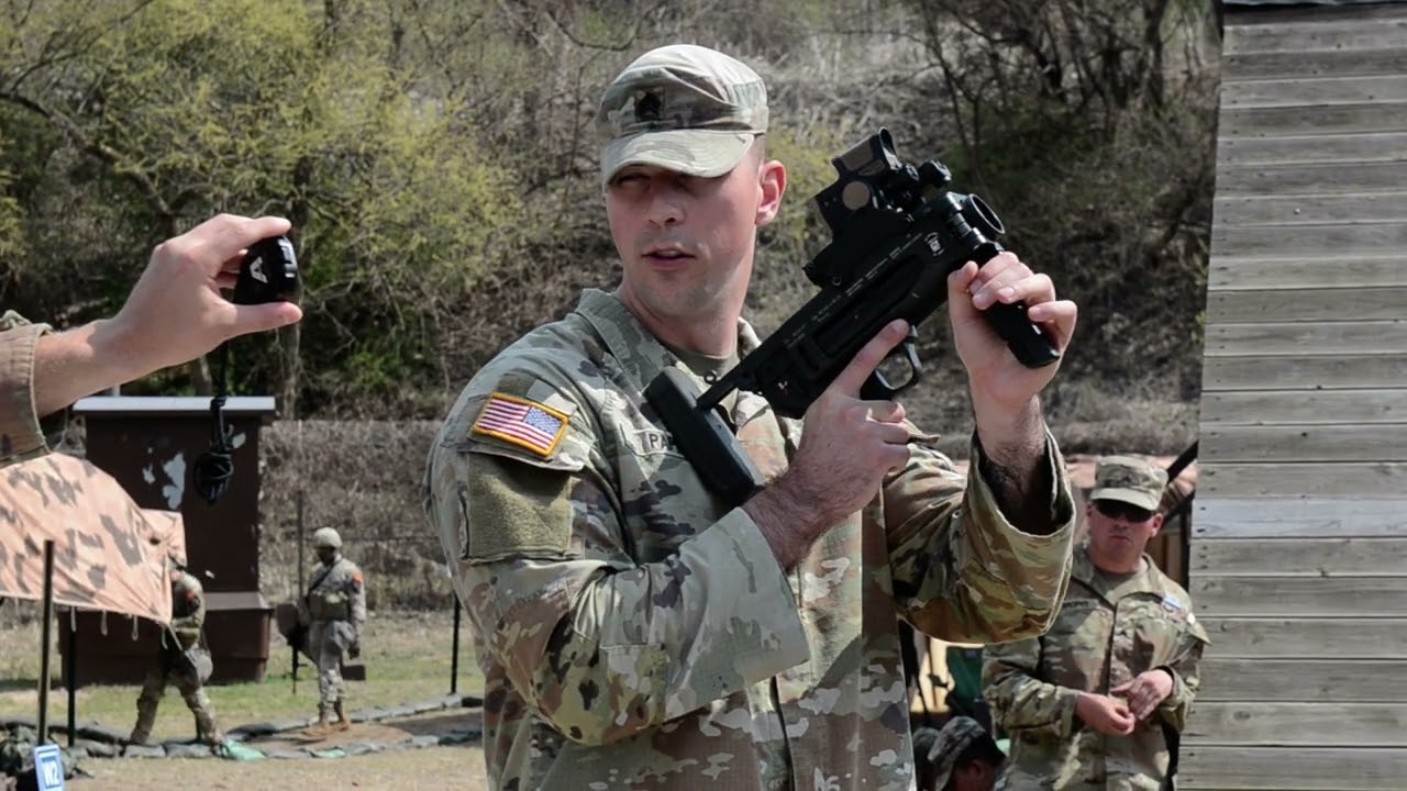 SGT Papp demonstrating the M320 Grenade Launcher.