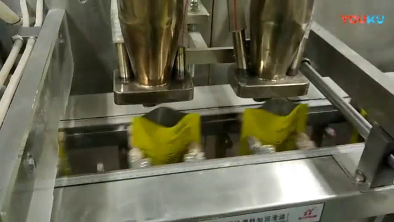 Automatic dual output premade pouch powder packaging machine