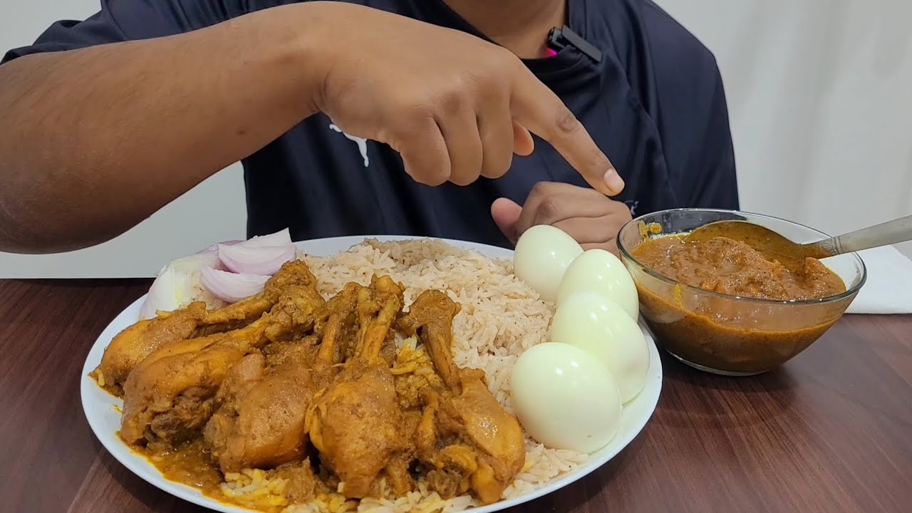 EATING SPICY CHICKEN PULAO WITH BOILED EGG