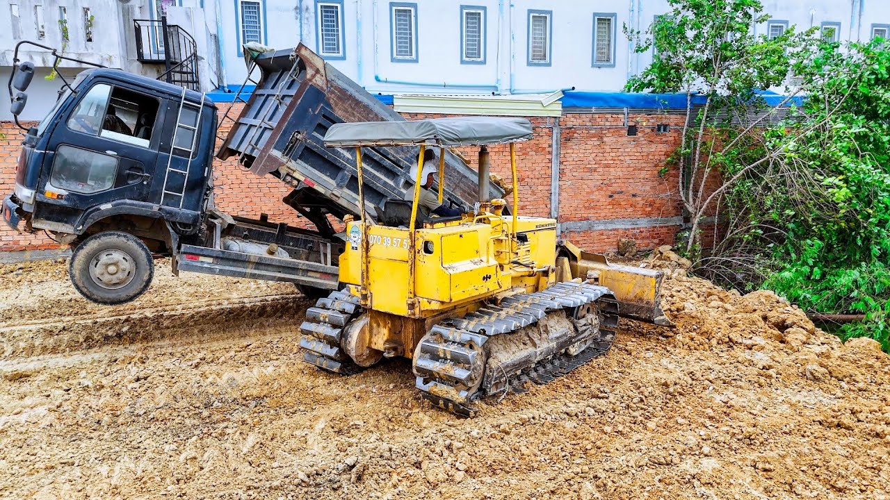 Wonderful Showing Project Land filling up use 5ton truck pouring soil, Dozer D31 pushing clear land