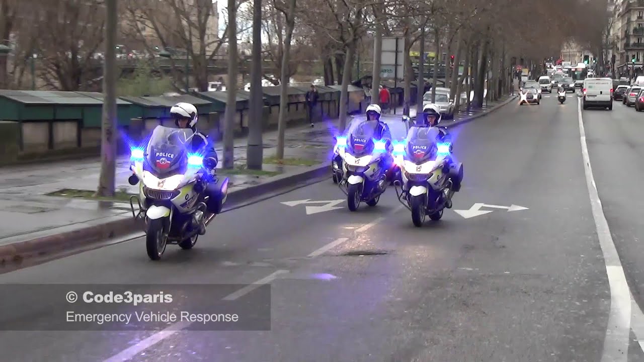 Police Motorcycles Responding Lights and Sirens to Emergencies in Paris