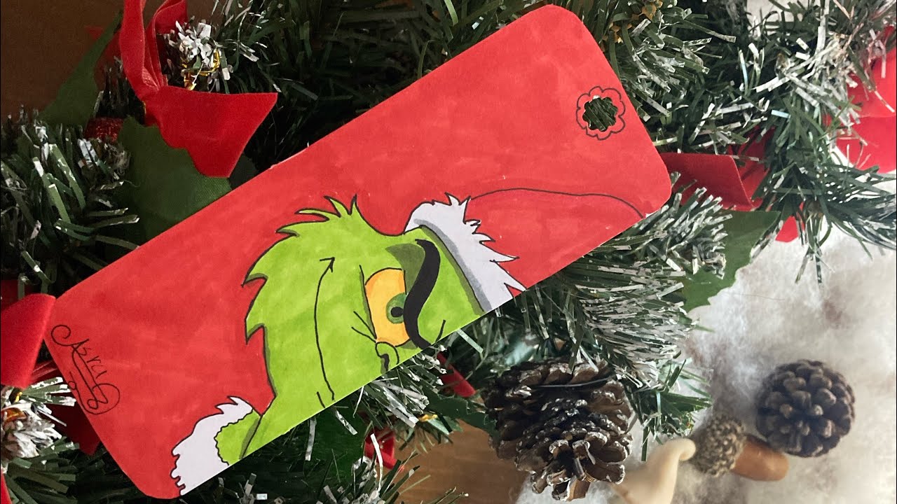  **When the Grinch Appears… 👀A Grinch Bookmark That Shows Christmas Differently** 🎄