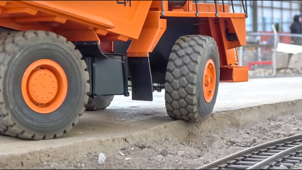 Huge rc Excavator on wheels and some relaxing rc trucks and construction site footage