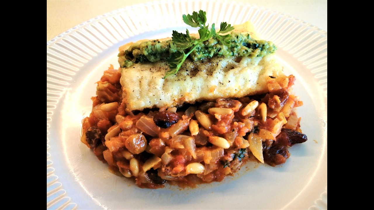 Bacallà amb panses i pinyons.