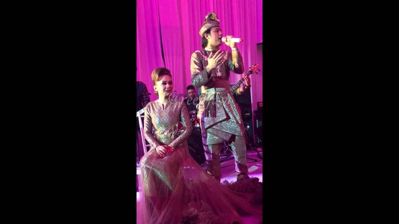 The groom Akim singing for the bride Stacy