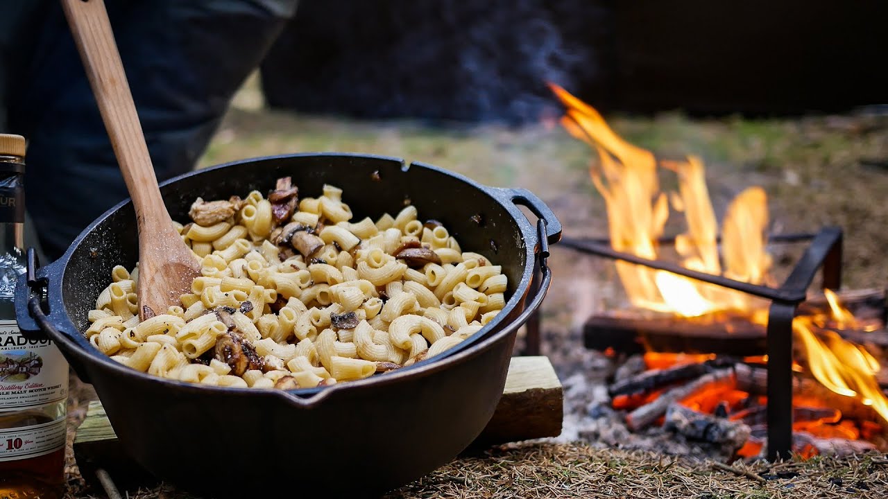 Outdoor cooking in the forest - Petromax dutch oven campfire casserole with whisky
