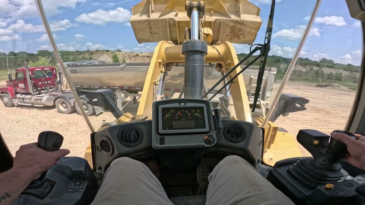CAT 972M Stockpiling 57's and Loading Trucks