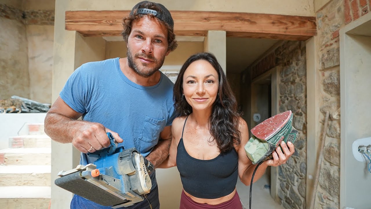 Sanding the beautiful wooden beams inside our old stone house