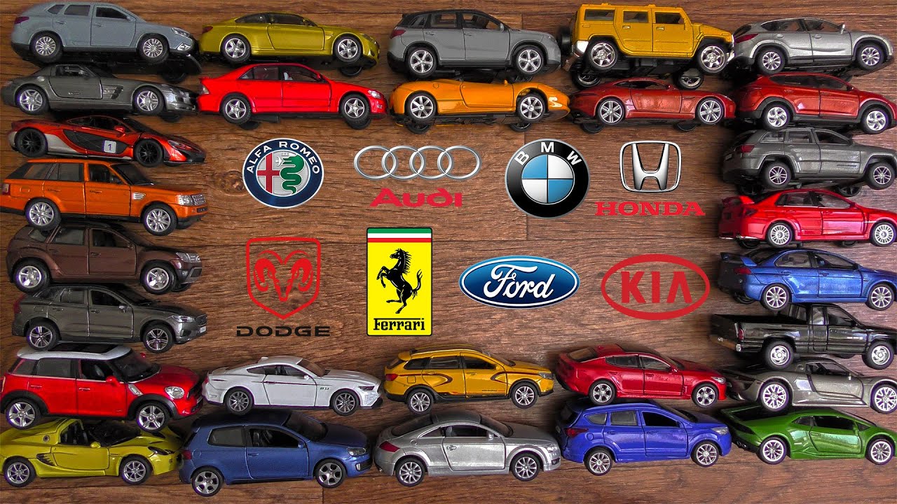 Lots of Scale Cars With Logos are Being Shown Closely in Hands