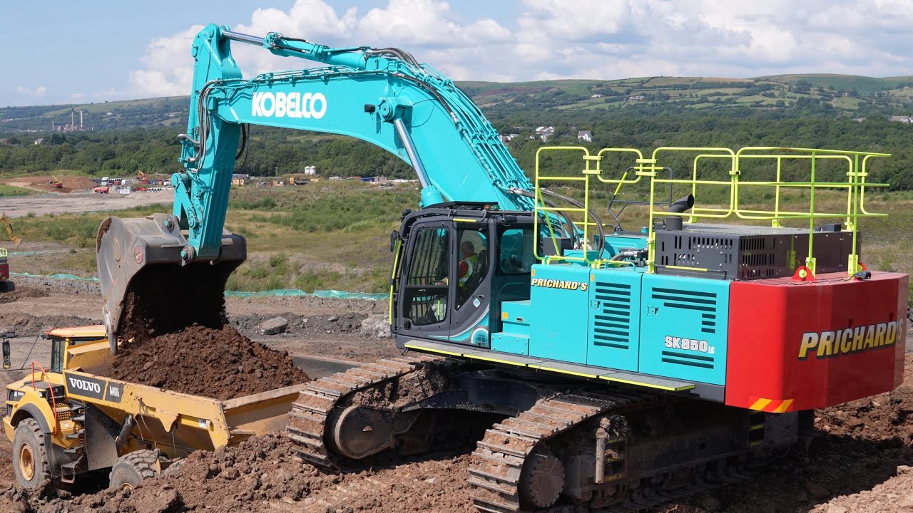 Big Kobelco SK850 Excavator Loading Trucks