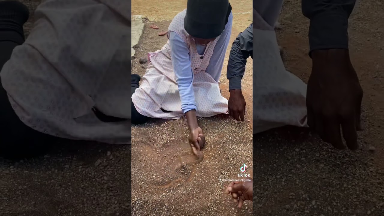 Matalane Mokgatla playing Indigenous games with his family #dipapaditšaselegae