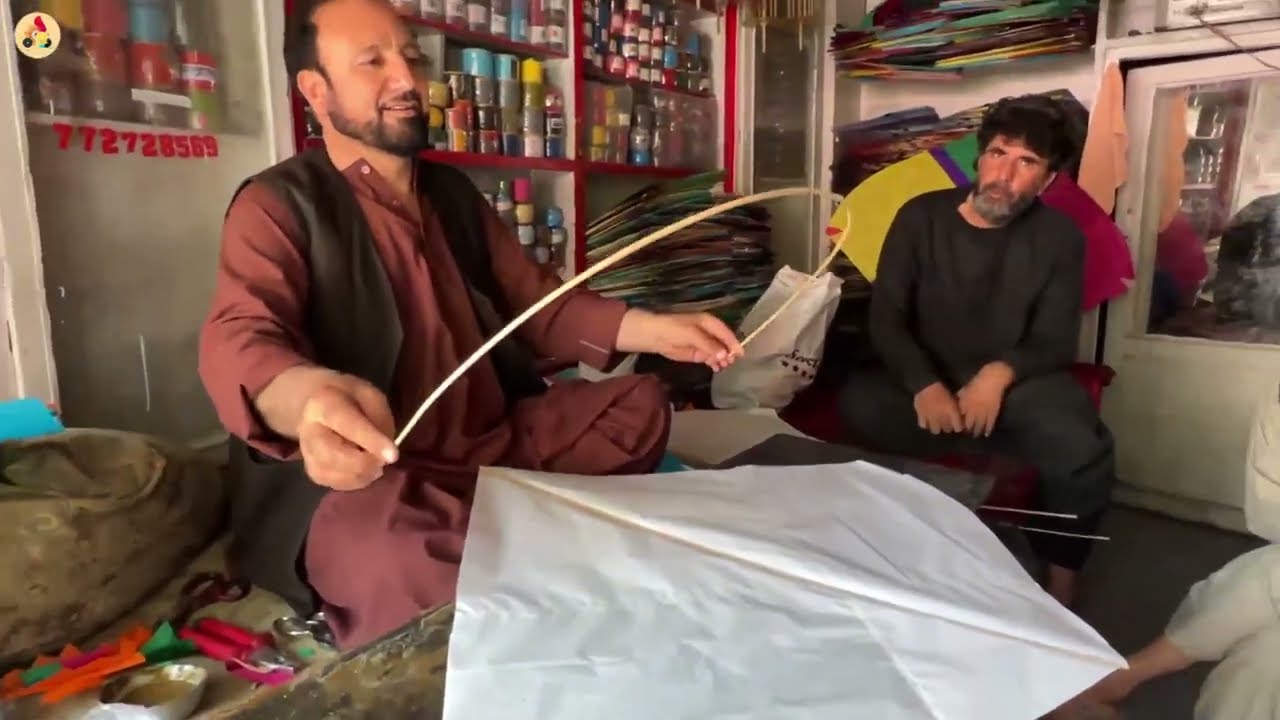 Making a kite for a competition by an Afghan