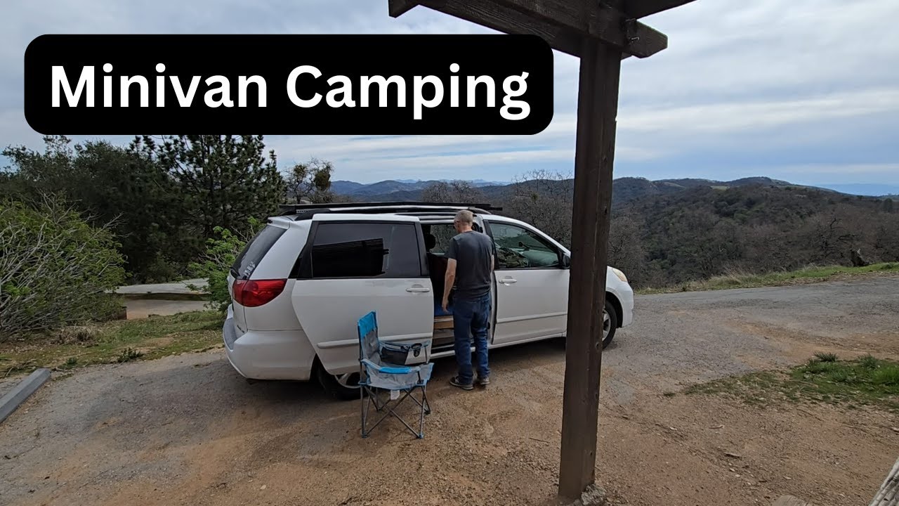 Old man camping in a minivan