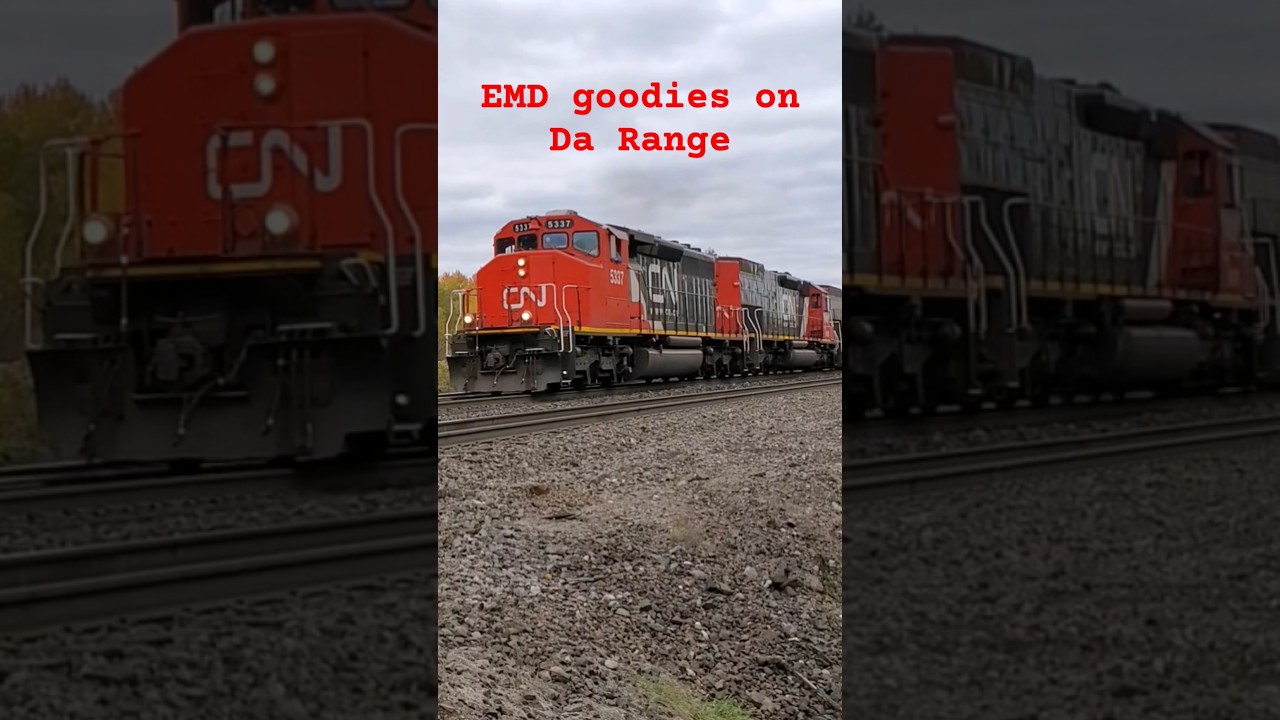 A quad set of EMDs lead a loaded limestone train to Minntac, passing through Iron Junction