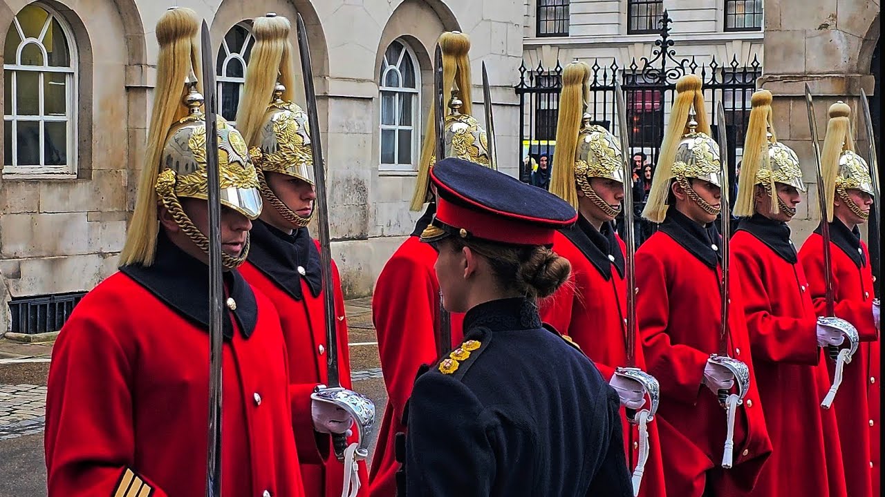 LADY CAPTAIN inspects WINTER CLOAK wearing Life Guard troopers at Horse Guards!