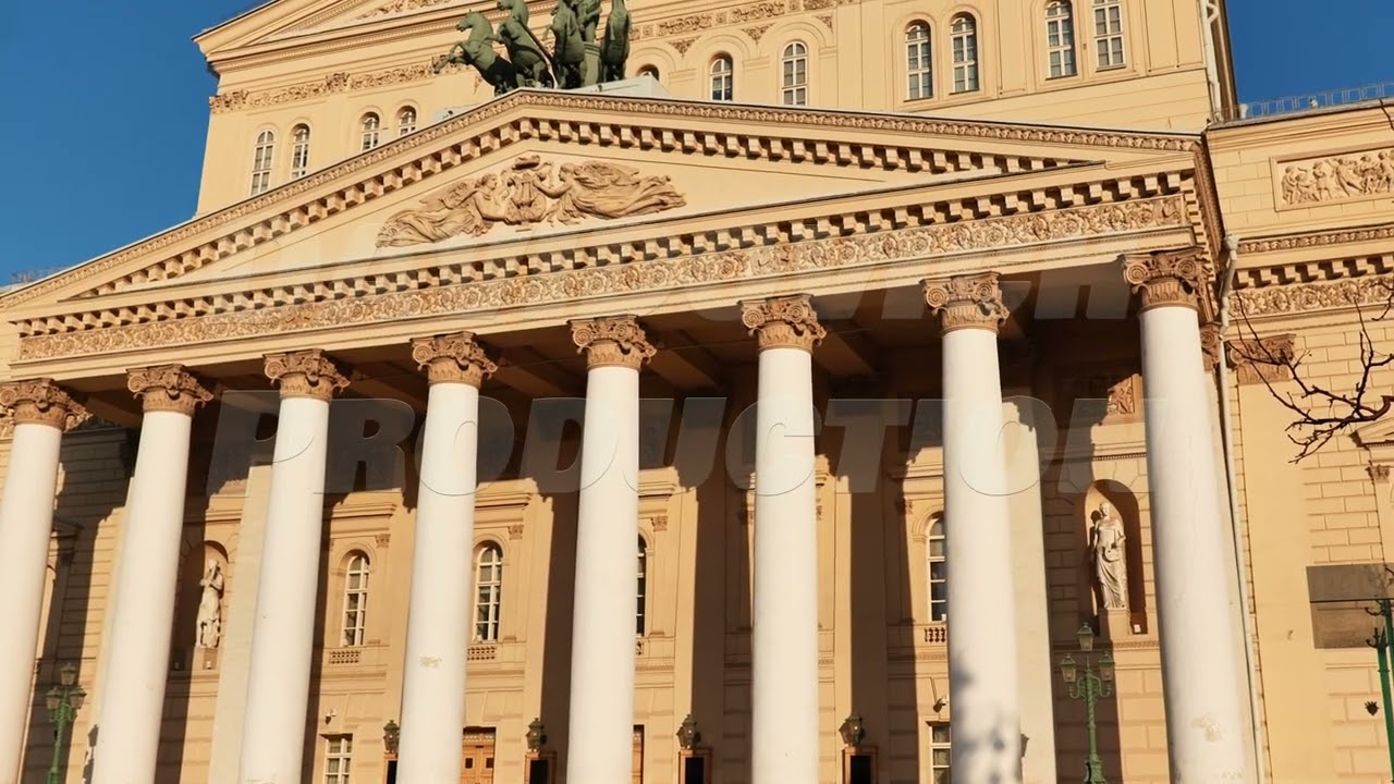 Bolshoi Theatre majestic facade with columns illuminated by sunlight in Moscow