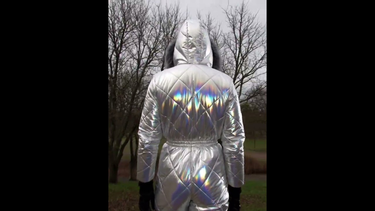 Walking in white and silver amalgam ski overalls and a black mask panoramic CM-6