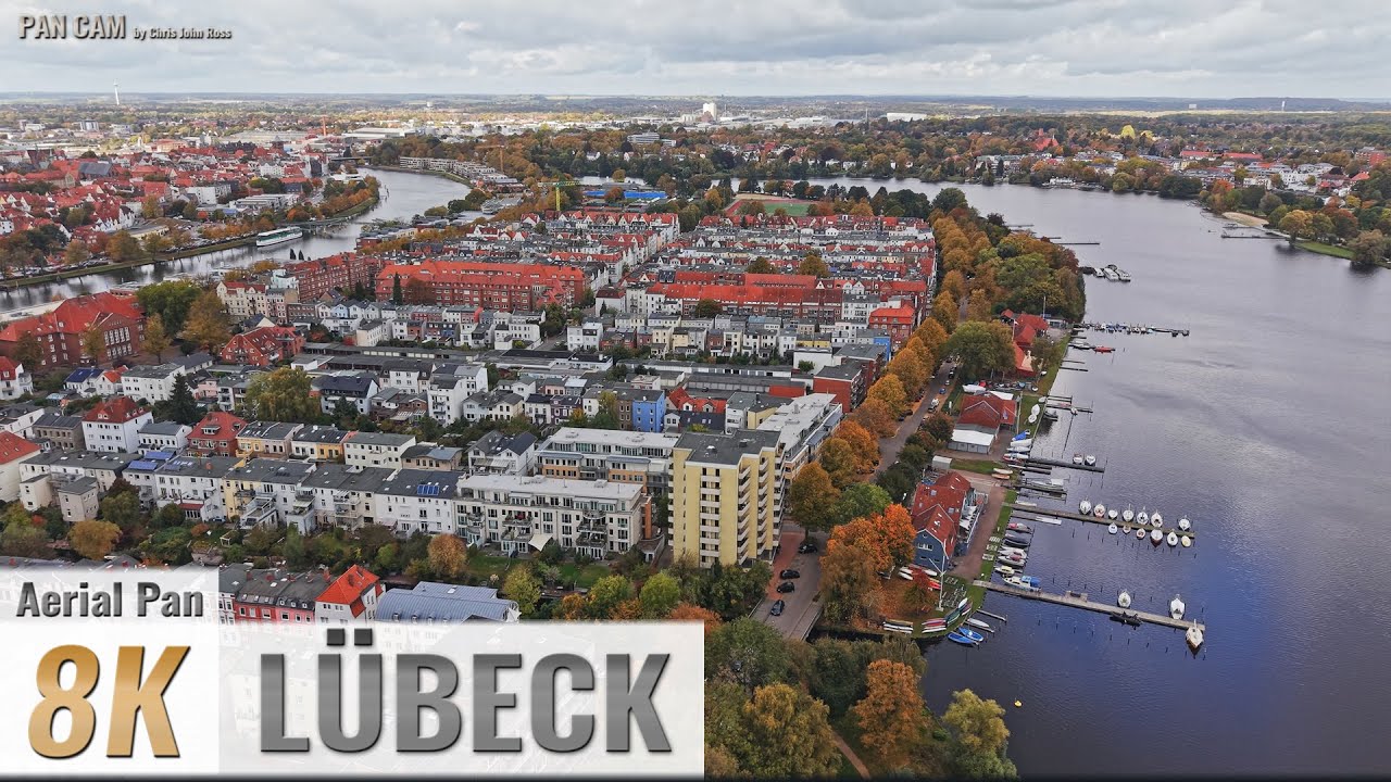 L&uuml;beck, Germany: St. J&uuml;rgen, Innenstadt, St. Gertrud - Wakenitz - 180&deg; Aerial Pan - 4K/8K - 0551