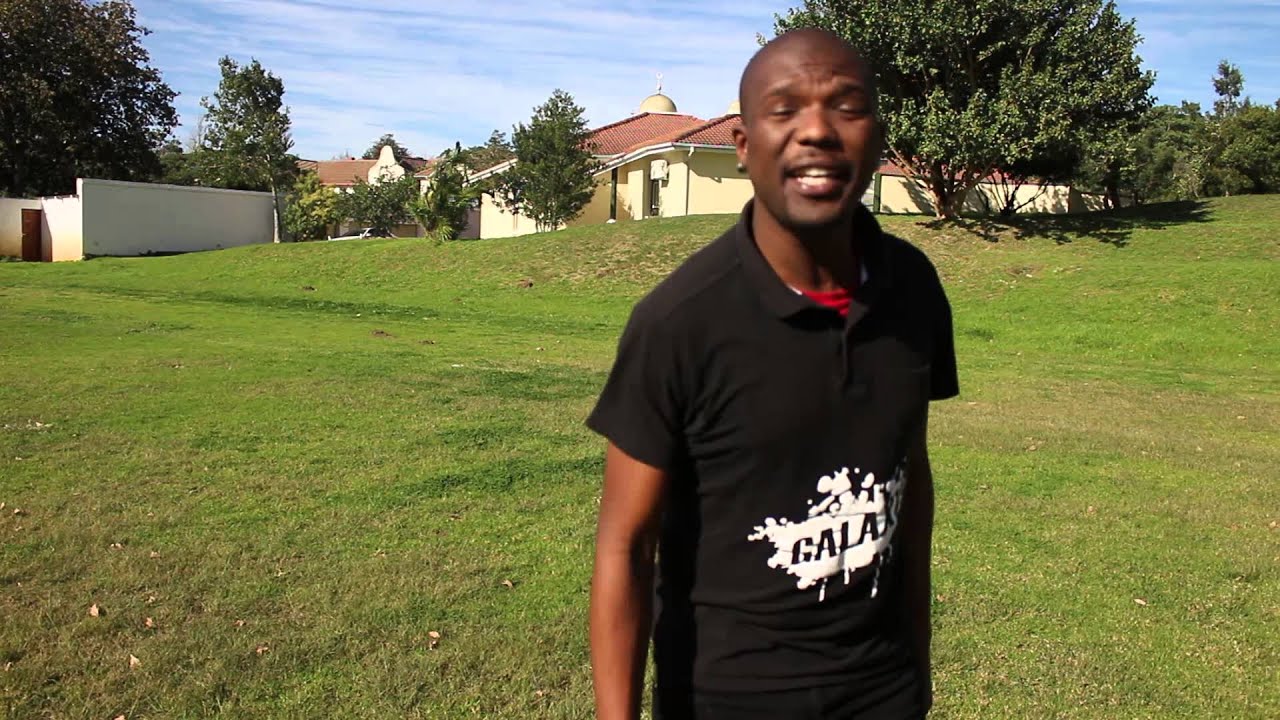 Sithembiso Kos performing his Xhosa poem 'Ubungekaqhathwa' in the fields at Rhodes University.