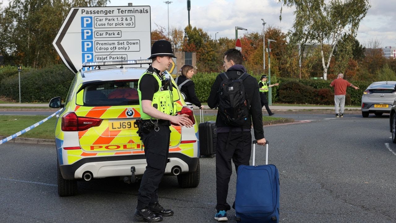 Passengers evacuated and planes grounded as police swoop on Birmingham Airport | SWNS