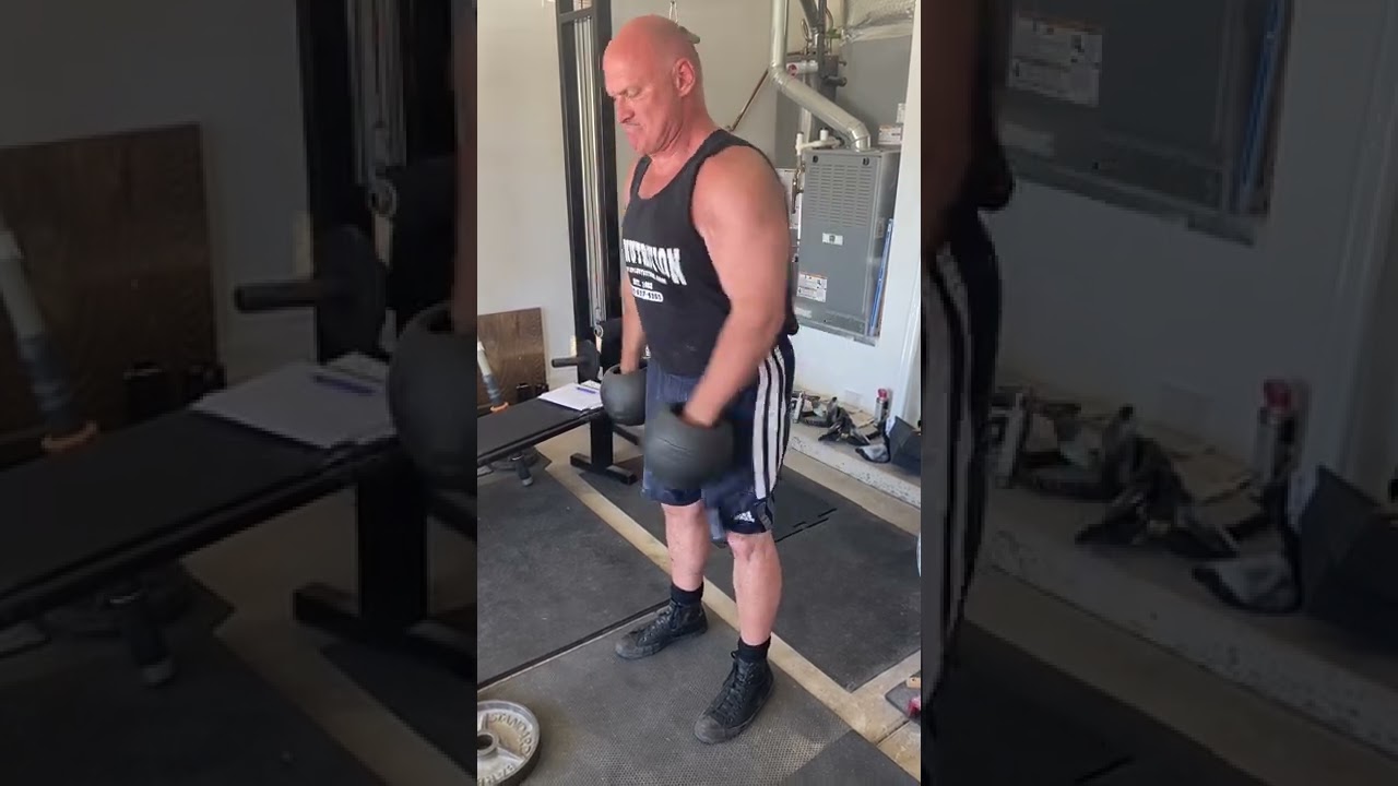 Thompson Fat Bells cross body hammer curls with 45 lbs for 6 alternating reps each.